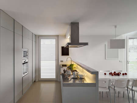 interiors hosts of a modern kitchen with modern tableand and chairsの写真素材