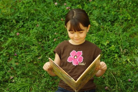 Girl reading a bookの写真素材