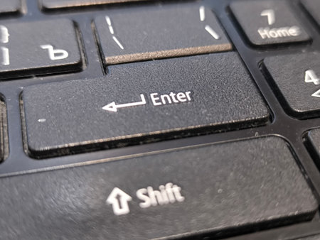 Close up of a laptop keyboard. Selective focus on enter button.の写真素材