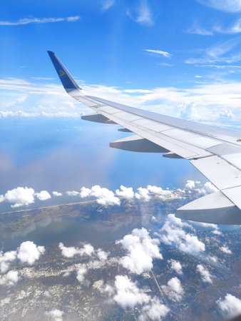 Air Astana aircraft wing views during flight from Almaty to Da Nang flight over Vietnamのeditorial素材