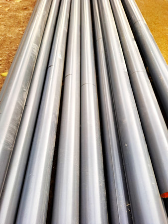 steel pipes in a construction site, closeup of photo with selective focus