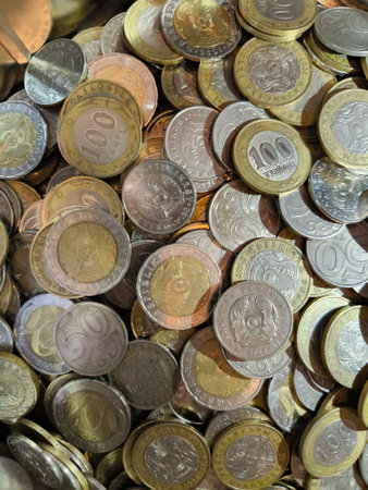 Large Collection of Mixed Metal Coins from Kazakhstan Currency. A close-up of a pile of various...
