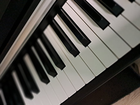 A selective focus shot captures the elegant perspective of musical instrument keys in a rhythmic...