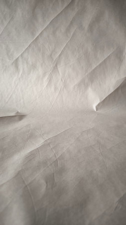 White crumpled sheet of paper as an abstract background. Textureの写真素材