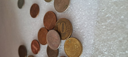 Assorted currency from different countries scattered together representing global finance and...