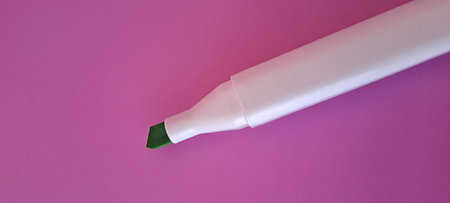 Highlighter pen on a pink background, close-up.の写真素材