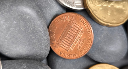 Coins on pebbles background. Business and finance concept.