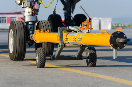 Pushing the plane back the cart on the front landing gear of the chassis