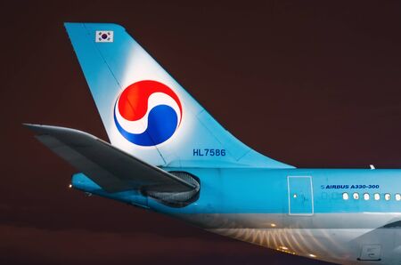 Night view of the airport and the tail plane Korean air. Russia, Saint-Petersburg April 2017のeditorial素材