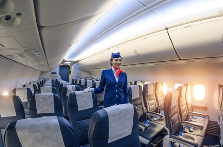 Stewardess and passenger lounge inside the Boeing 737-800. Russia, Saint-Petersburg, November 2016のeditorial素材