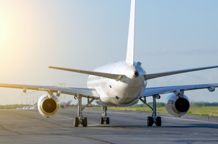 White plane steers to the terminal at the airport after landingの写真素材