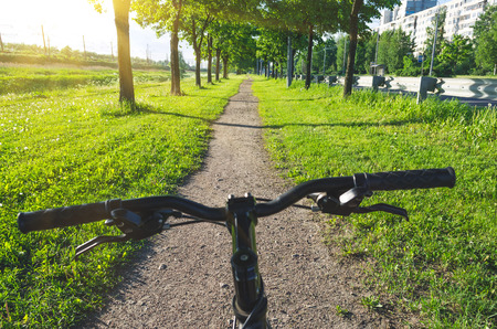 Bicycle rudder view of the dirt road along the alleysの写真素材