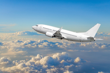 The airplane climbs hight flight cloud skyの写真素材