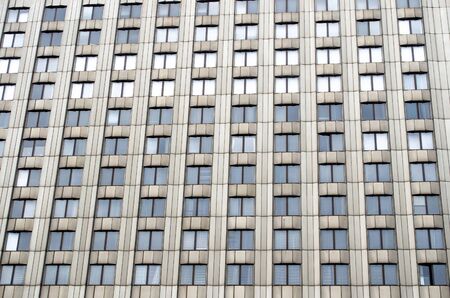 Many windows a tall urban building of monophonic colorの写真素材