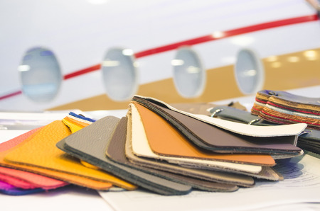 Natural leather upholstery samples with stitching in various colors