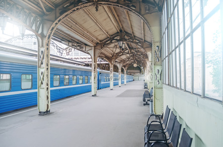 Vintage retro platform passenger railway station. Concept of meeting, waiting, seeing people on the road tripの写真素材