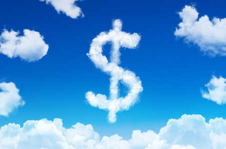 Symbol of a dollar in the form of clouds of steam against a blue sky with cloudsの写真素材