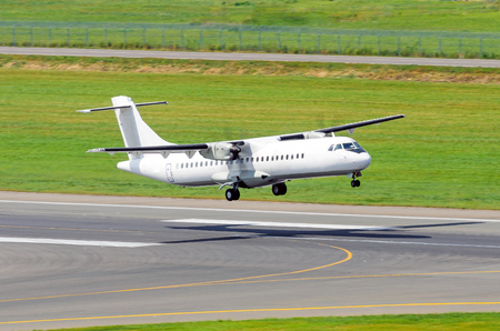Airplane detaches from the runway at the airportの写真素材