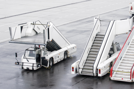Passenger ladders for boarding passengers in an airplaneの写真素材