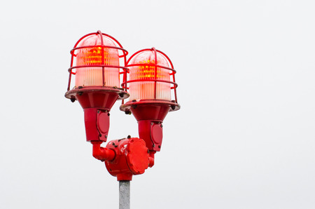 Red warning lights of the lamp, warning at the edges of high buildings objectsの写真素材