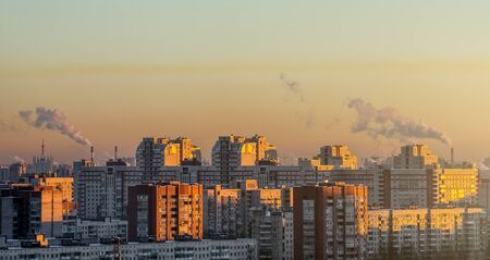 Residential arrays of high-rise buildings on the horizon sunsetの写真素材