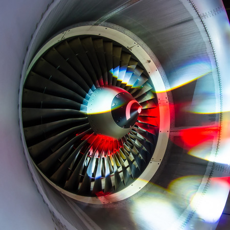 Engine of the plane with blades is illuminated with light of disco, the party shines of soffits