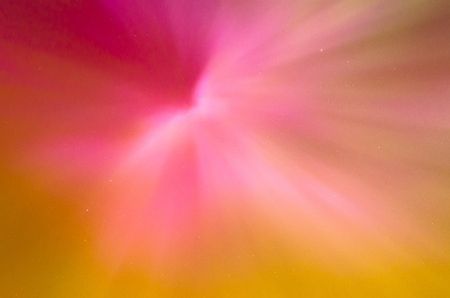 Polar lights Aurora Borealis in the night starry sky, texture and pink warm colored natural phenomenaの写真素材