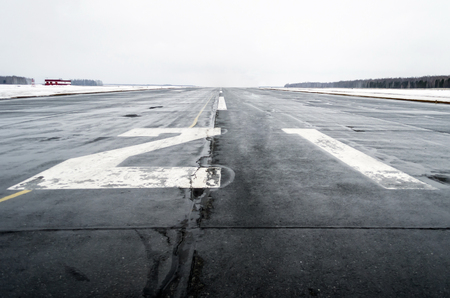 Wet to the airport in cloudy weather in winterの写真素材
