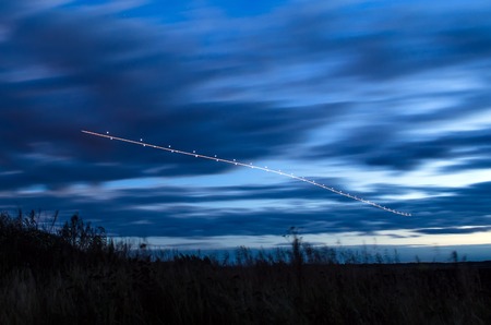 Night lights, tracks of lights in the movement of aircraft on long exposureの写真素材