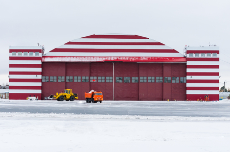 Hangar building in winter in a snowy airportの写真素材