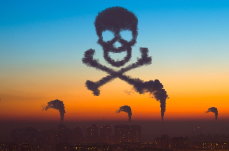 Cities and industrial smoke clouds the sky sunset in the form of a skull with bones, a sign of danger of air pollution and the Earth's atmosphereの写真素材
