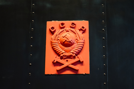 Golden soviet CCCP emblem with hammer and sickle on a marble plate. Russia. Saint-Petersburg. Museum Railways of Russia December 21, 2017.のeditorial素材