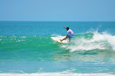 Surfer in green blue in the ocean wave, surfing. Indonesia, Bali, 10 November 2011のeditorial素材