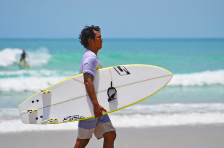 Surfer in green blue in the ocean wave, surfing. Indonesia, Bali, 10 November 2011のeditorial素材