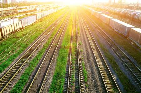 Railway at the marshalling yard sunset, freight train railway carriageの写真素材