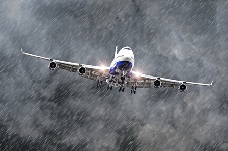 Large passenger airplane approaches the landing at the airport of rain, bad weatherの写真素材