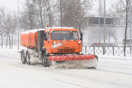 Road cleaning snow-removing machine in the city after huge snowfallの写真素材