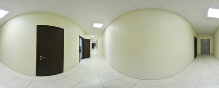 Spherical 360 degrees panorama projection, panorama in interior empty long corridor with doors and entrances to different roomsの写真素材