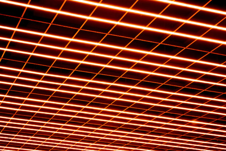 Abstraction of light-emitting diode lines, laser of a red shade of a surface on a dark backgroundの写真素材