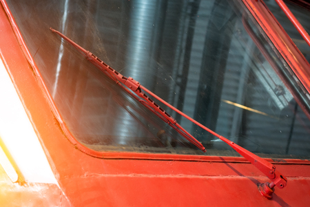 Old windshield wipers on the windshield of a locomotive trainの写真素材