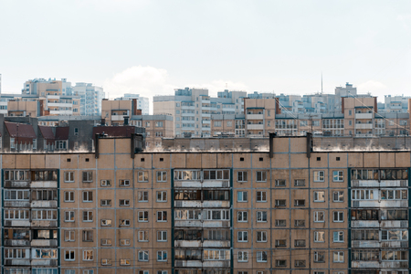 Residential houses. On the roof you can see steam from the evaporating moisture in the sunの写真素材