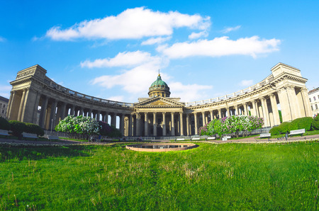 Kazan Cathedral with white clouds in the sky, grass meadow in Saint Petersburg summer lilac. Wide angle view, panoramaの写真素材