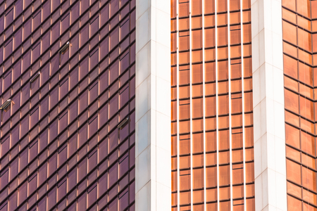 Angle glass red, burgundy, brown facades of a window of financial skyscrapers, a corner of a...