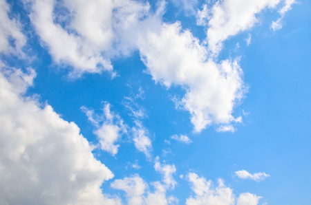 Blue sky with white summer cumulus cloudsの写真素材