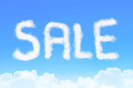 Inscription sale in the clouds against the blue skyの写真素材
