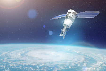 Research, probing, monitoring of tracking in a cyclonic vortex, a hurricane. Satellite above the...