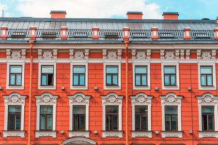 Hotel facade red building with window archesの写真素材