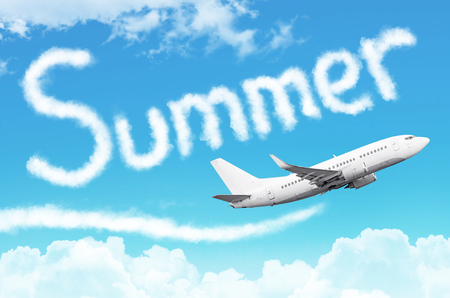Word Summer drawn from clouds airplane in the blue sky, concept travel tourism holiday vacationの写真素材