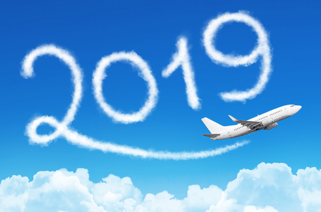 Happy New year 2019 concept. Drawing by airplane vapor contrail in skyの写真素材