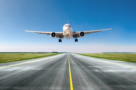 Airplane aircraft flying departure after flight, landing on a runway in the good weather clear sky dayの写真素材